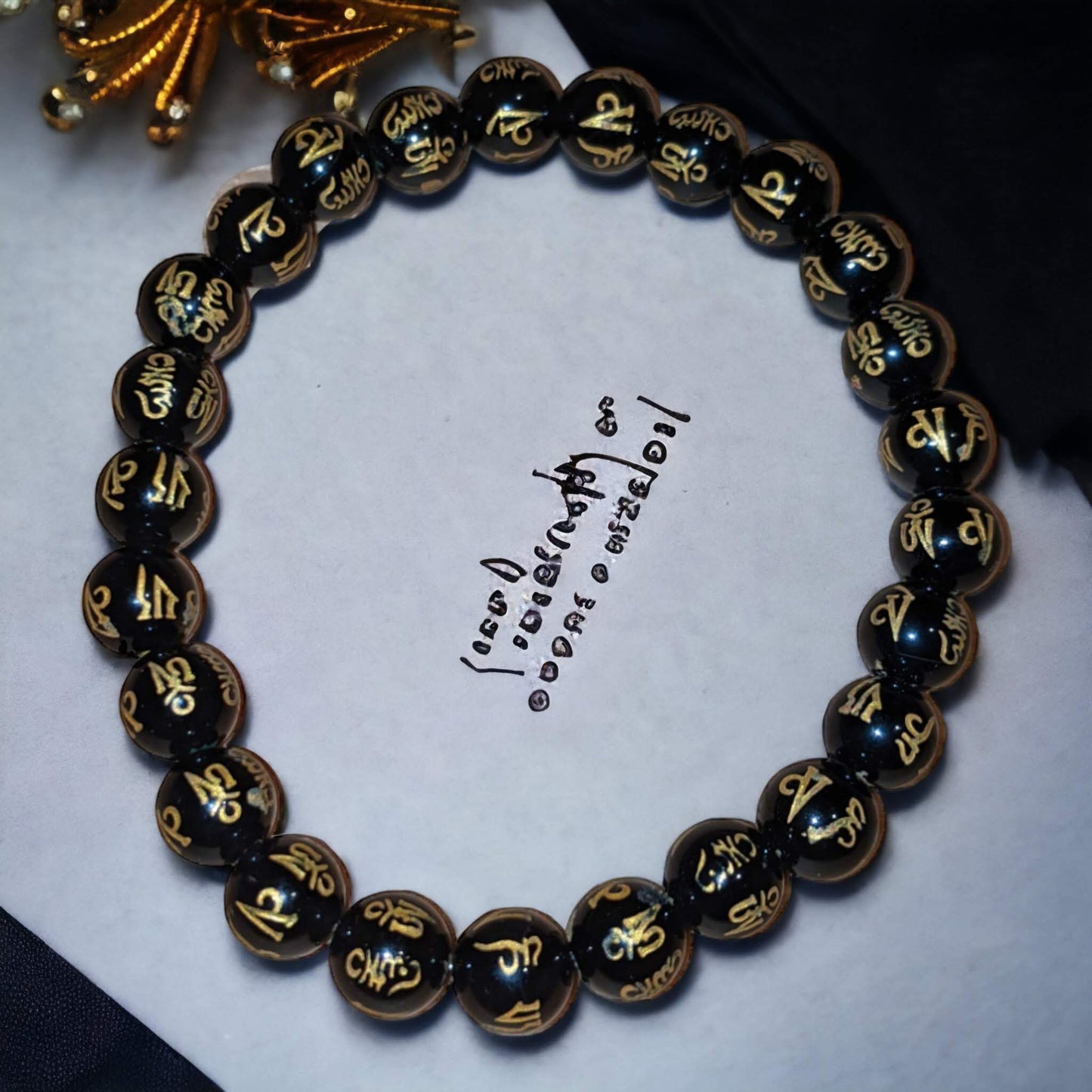 Black Onyx Bracelet with Golden Tibetan Inscriptions