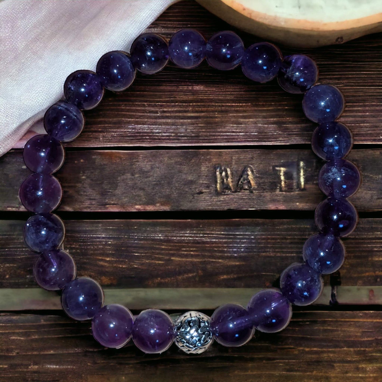 Amethyst Bracelet with Silver Tibetan Bead Centre