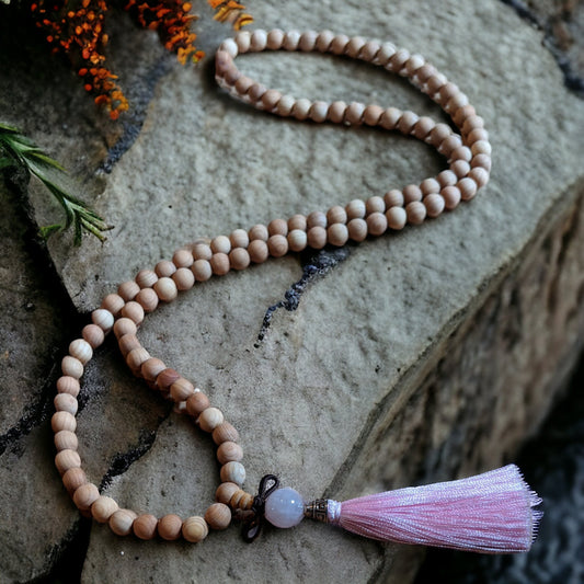 Mala: Sandalwood with Rose Quartz Guru Bead and a Pink Tassel