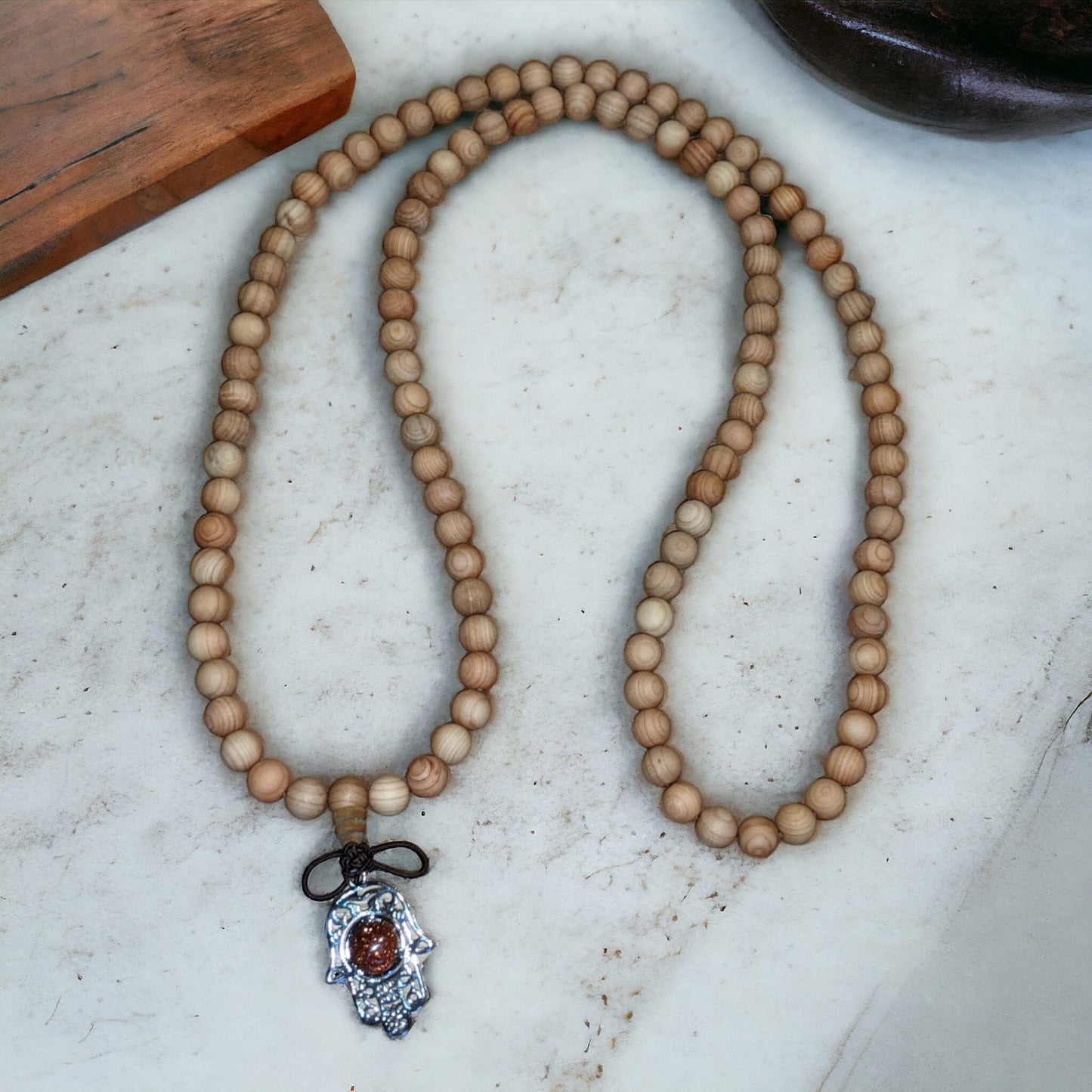 Mala: Sandalwood with Brown Goldstone Hamsa Hand Protection Charm